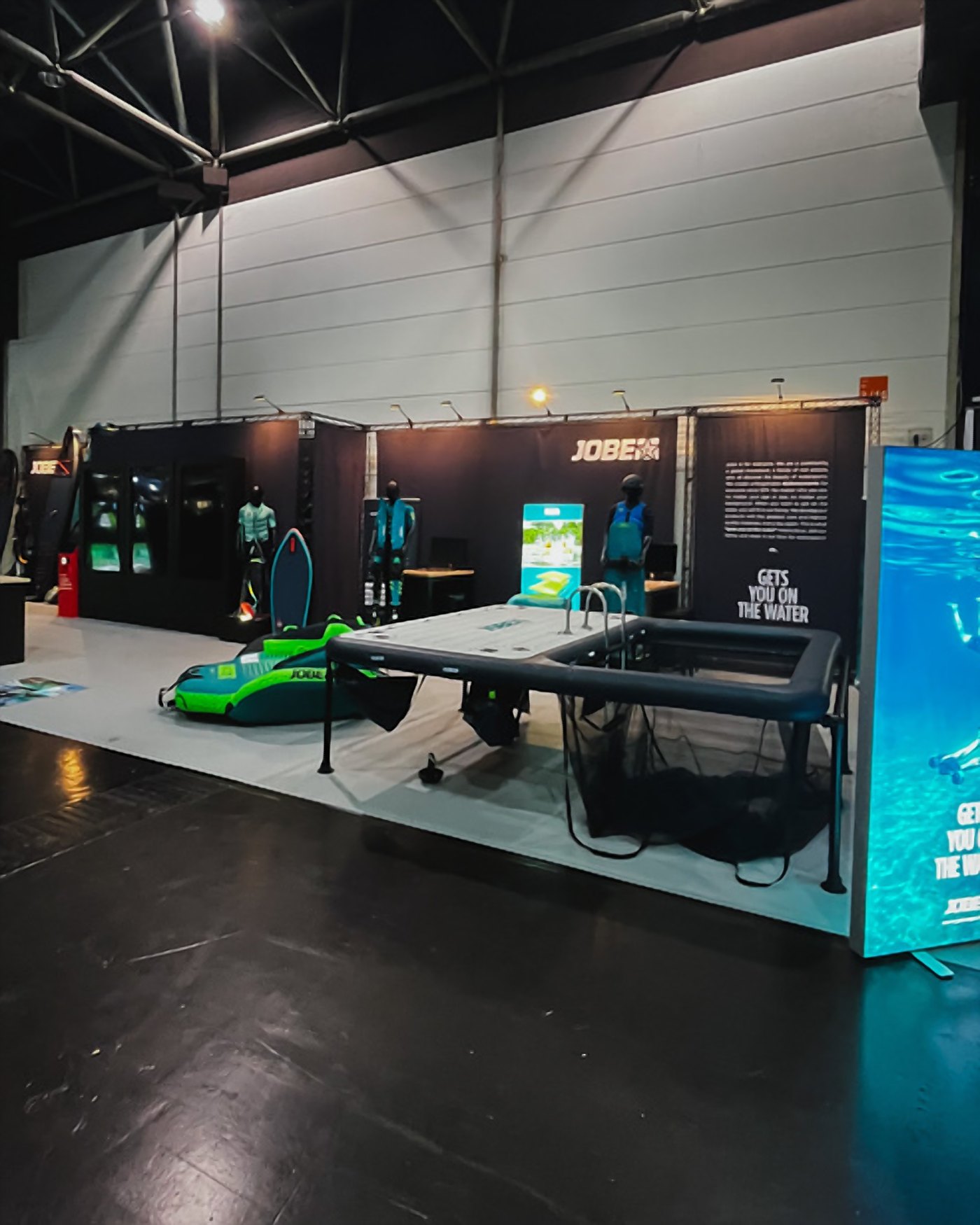 Jobe trade show stand with a SUP display
